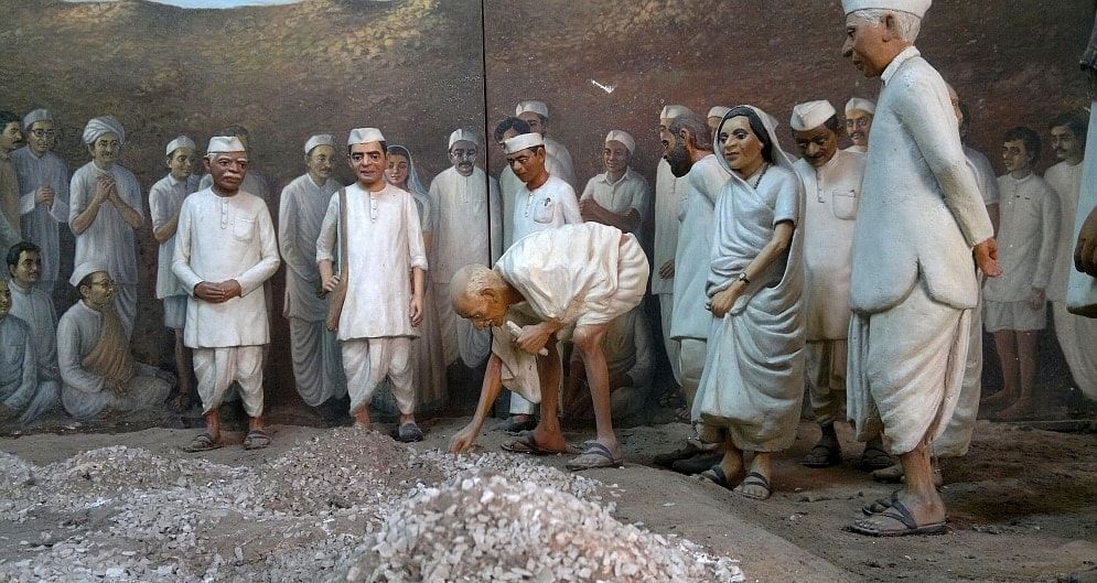 Mahatma Gandhi breaking the Salt Law 