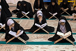 Muslims reading Holy Quran